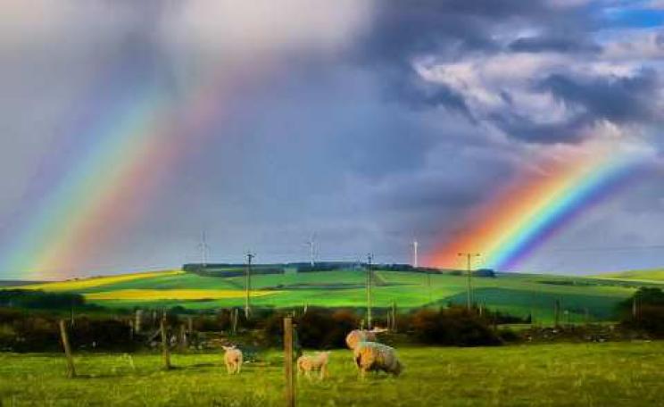 Is Cameron's policy to put an end to onshore wind power an illusion? Double rainbow with wind turbines. Photo: Gordon Robertson via Flickr.com.