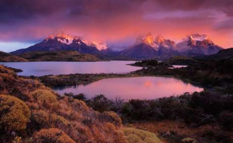 The Most Beautiful Place in the World: IMHO - Torres Del Paine National Park, Chile. This amazing light lasted for only a couple of minutes at sunrise. The rest of the day was cloudy and overcast. Photo: © Peter Essick.