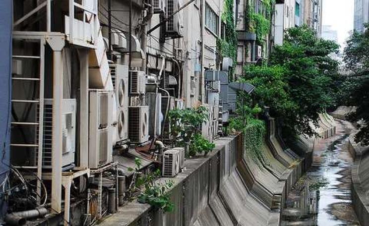 These air conditioners in Shibuya, near Tokyo, are only adding to summer temperatures. Photo: Amir Jina via Flickr.