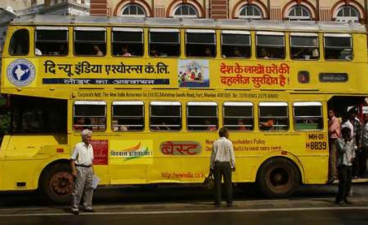 Improving public transport is one of the key measures that could cut GHG emissions, increase 'gross world product' by $2.6 trillion and save a million lives. Photo: Mumbai bus by Patrik M. Loeff via Flickr.