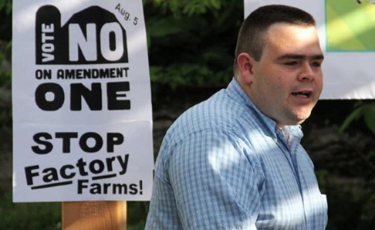 Local Farmers Speak Out Against "Right to Farm" - Jake Davis, a farmer and co-owner of the Root Cellar grocery store, speaks against Amendment 1 at the Missouri’s Food for America sign-making event at Café Berlin Friday, June 27, 2014 in Columbia, Miss