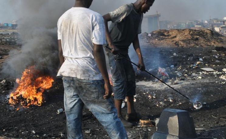 Aglogbloshie - burning off plastic to get to valuable metals. Photo: qamp.net via Flickr.