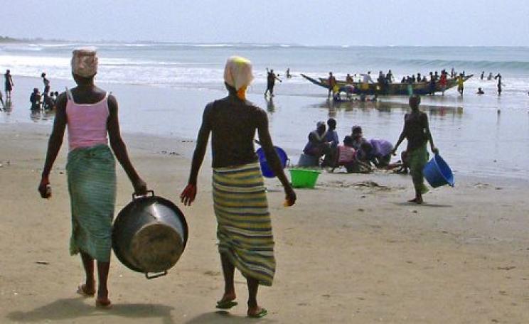 Fisherfolk on the beach, The Gambia. Photo: Angus Kirk via Flickr.