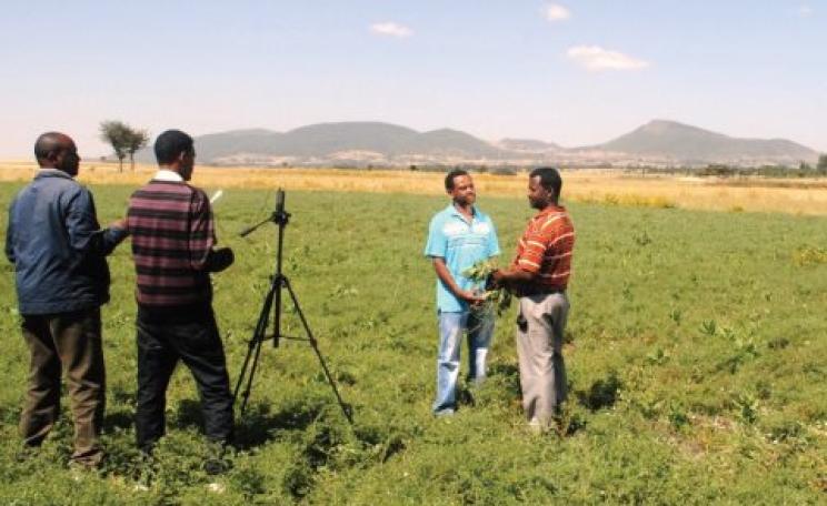 Digital Green records a discussion on best agronomic practice with an Ethiopian farmer for dissemination among his peers. Photo: Digital Green.