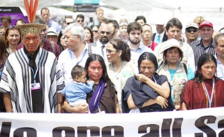 At COP20 in Lima, Indigenous protestors from Saweto in the Peruvian Amazon protest at ongoing land grabs and murder of their leadeat the COP20 in Lima, Peru. Photo: Luka Tomacrs / Friends of the Earth International.