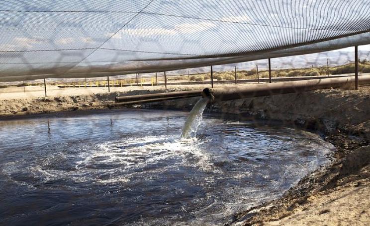 Local impacts matter too! Fracking fluid and other drilling wastes are dumped into an unlined pit located right up against the Petroleum Highway in Kern County, California. Photo: Faces of Fracking via Flickr (CC BY-NC-ND 2.0).
