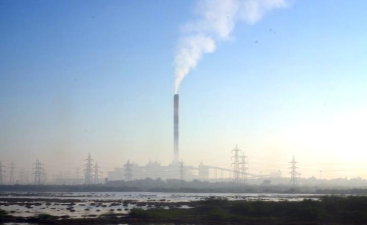 India's human rights and environment are going up in smoke - sacrificed to an aggressive coal-fired development path. Photo: coal power plant outside Hyderabad, Andhra Pradesh, India, by Reuben Stanton via Flickr (CC BY-NC).