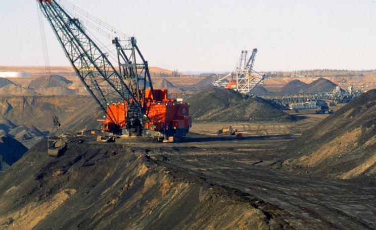 Despite the exploitation of unconventional oil resources like high-cost tar sands (pictured in Canada) and shales, peak oil really is upon us. Photo: Gord McKenna via Flickr (CC BY-NC-ND).