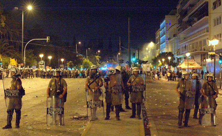 The real battle is only just beginning. Riot police in Syntagma late in the night after large demonstration of 'Indignados', in Syntagma Square, Athens, Greece, 29th June 2011. Photo: Ggia via Wikimedia Commons (CC BY-SA).