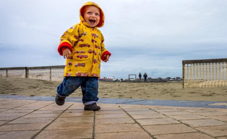 Does this rain-loving toddler need toxic PFC finishes to make his coat proof to Arctic storms? On balance, probably not. Photo: John Bastoen via Flickr (CC BY).