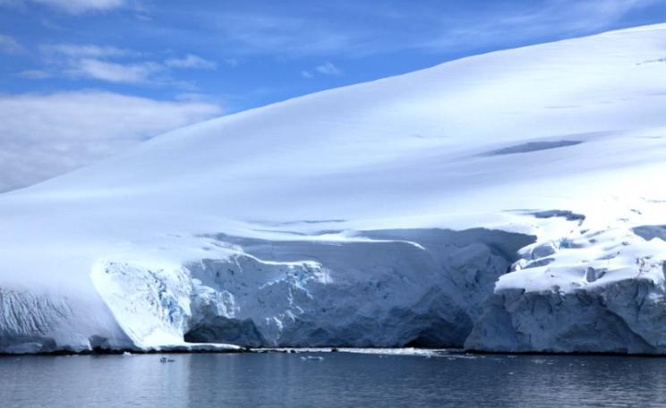 Ice may be breaking off the Antarctic's sea shores, but in its vast centre, ice mass is growing three times faster. Photo: Glacier in Penola Strait, Antarctica, by Liam Quinn (CC BY-SA).