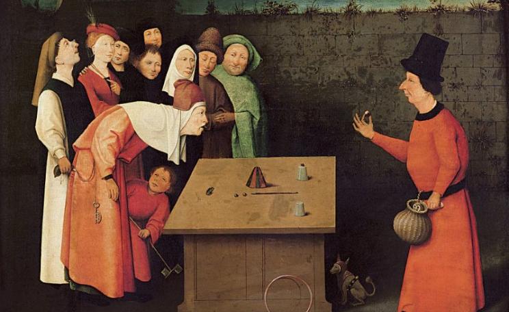 The real trick is happening where you're not looking. 'The conjurer' by Hieronymus Bosch, painted between 1496 and 1520, is now at the Musée Municipal, Saint-Germain-en-Laye, France. Photo: Public Domain / Wikimedia.