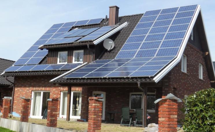 Solar and wind power are everywhere in Germany, putting the country on course for a 100% renewable electricity system by 2020. Photo: Tim Fuller via Flickr (CC BY).