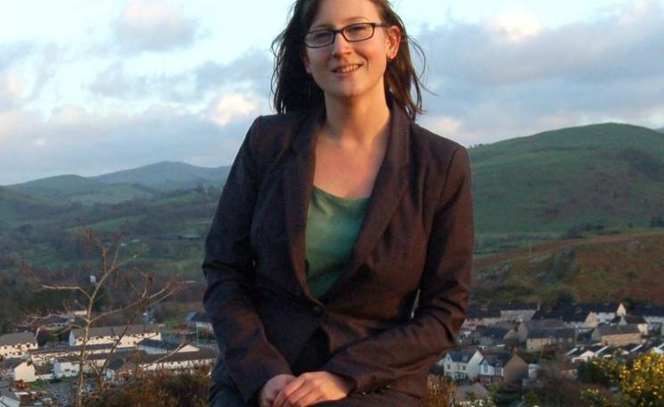 Alice Hooker-Stroud, leader of the Wales Green Party, on a hill overlooking her home town of Machynlleth in West Mid-Wales. Photo: Alex Randall via Flickr (CC BY-NC-ND).