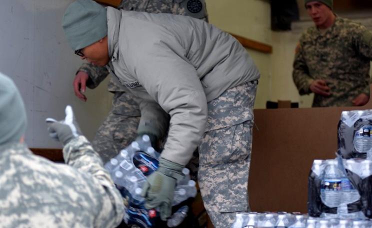 The Flint Water Response Team hard at work distributing bottled water to Flint residents. Photo: Michigan State Police Emergency Management and Homeland Security Division via Flickr (CC BY-ND).