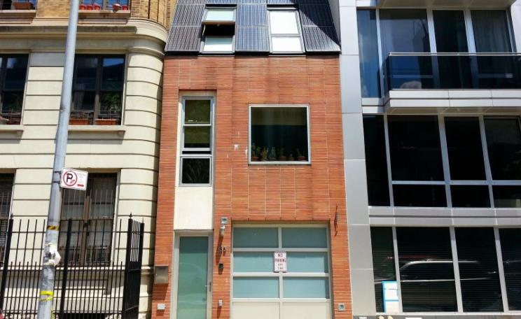 A solar-paneled shoebox on West 123rd Street, Central Harlem, Manhattan Island. Photo: Matt Green via Flickr (CC BY-NC-SA).