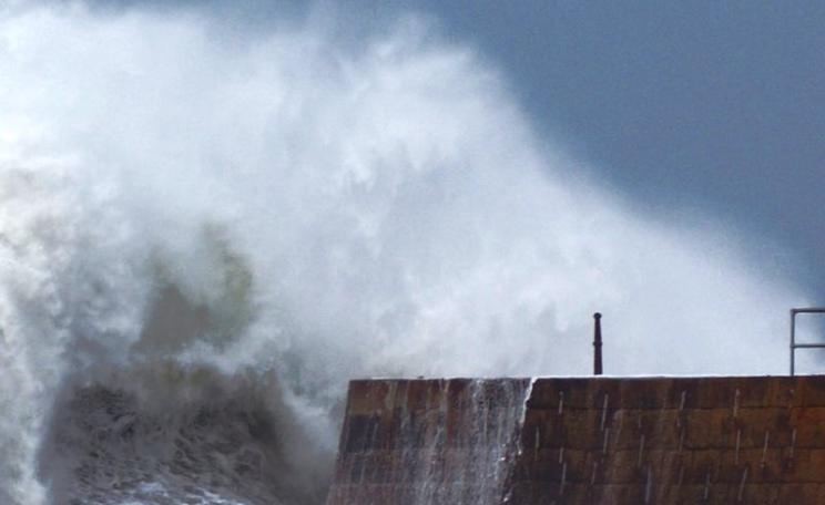 Raging seas: storm waves bear down on the already damaged Porthreath harbour wall, 1st February 2014. Photo: Philip Male via Flickr (CC BY).