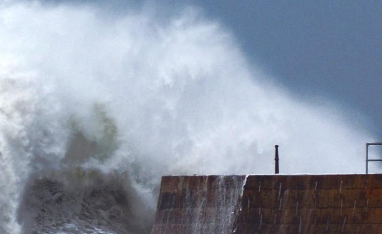 Raging seas: storm waves bear down on the already damaged Porthreath harbour wall, 1st February 2014. Photo: Philip Male via Flickr (CC BY).
