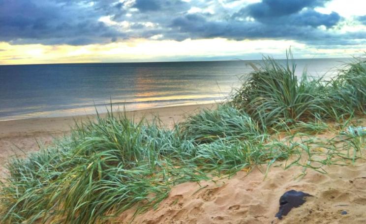 Behind the beach and dunes of Druridge Bay, planning permission for a 350 hectare opencast coal mine has been granted. But if turned into a solar power farm, the same land would produce as much electricity as the coal after 70 years. Photo: Doug Belshaw v