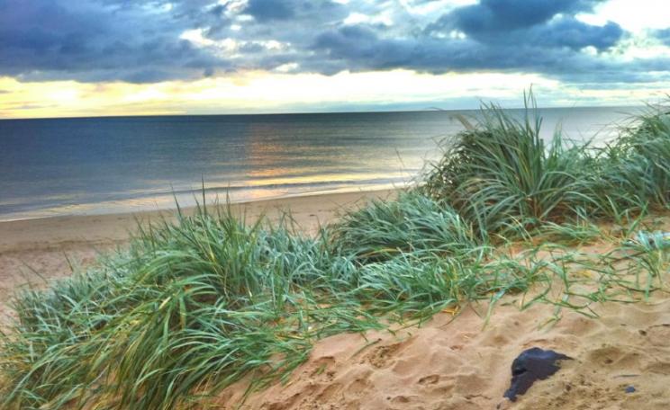 Behind the beach and dunes of Druridge Bay, planning permission for a 350 hectare opencast coal mine has been granted. But if turned into a solar power farm, the same land would produce as much electricity as the coal after 70 years. Photo: Doug Belshaw v