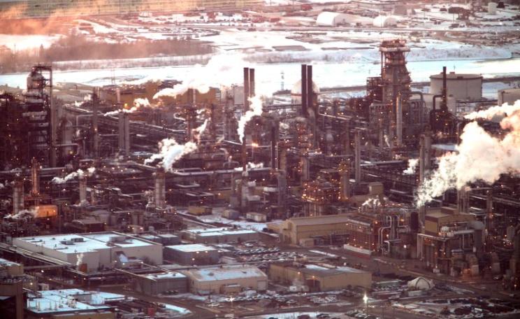 It may be possible to transform this landscape into a green energy park, or back to wilderness - but it's not going to happen soon enough without a corresponding political transformation! Tar sands refinery at Fort McMurray, Alberta, Canada. Photo: kris k