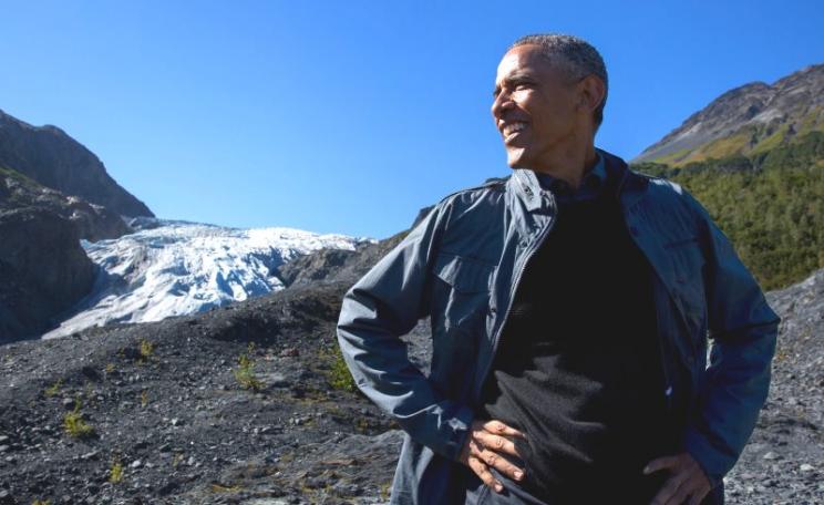 Will Obama's clean energy legacy outlast this Alaskan glacier? Chances are it may. President Obama stops for a break in Kenai Fjords National Park with Exit Glacier in the background. Photo: Pete Souza / The White House (Public Domain).