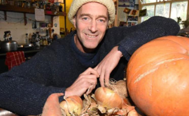 Hector Christie, with vegetables grown at the garden at his Tapeley Park estate and farm.