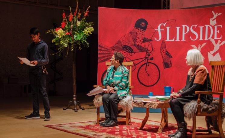 Dhylan Patel, winner of the under-16s category reading his poem, alongside poet Jackie Kay and Flipside's co-founder Liz Calder. Photographer's credit: Sophie Boleyn.