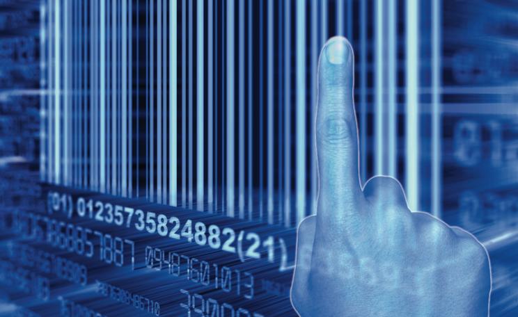 Finger pointing at a barcode